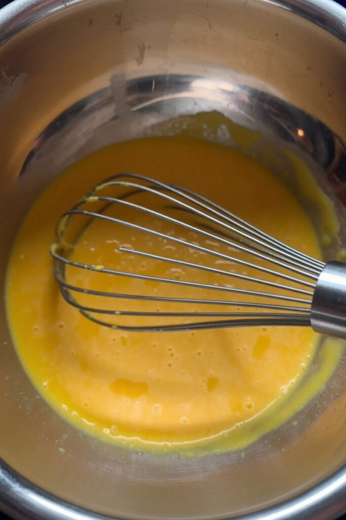 Whisking Egg  yolk, Corn syrup and Sugar